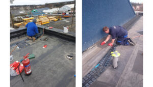 Men working on a new flat roof at height