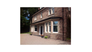 Beautiful house with bay windows, showing new double glazing