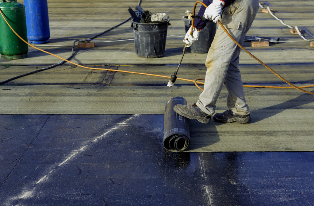 Roofer preparing flat roofing in Aberdeen
